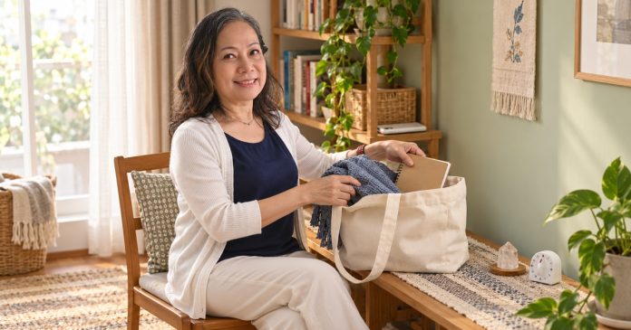 Create a Meditation Space at Home: Three Simple Setups Woman arranging a small portable reflection kit beside a comfortable chair